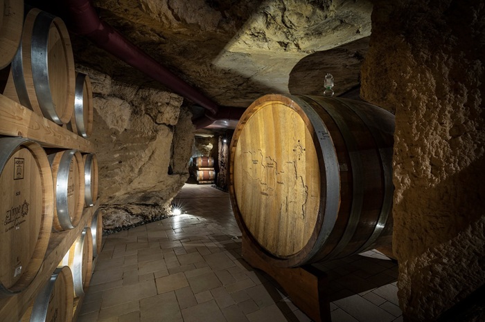 Zymè, a winery in a quarry with barrels